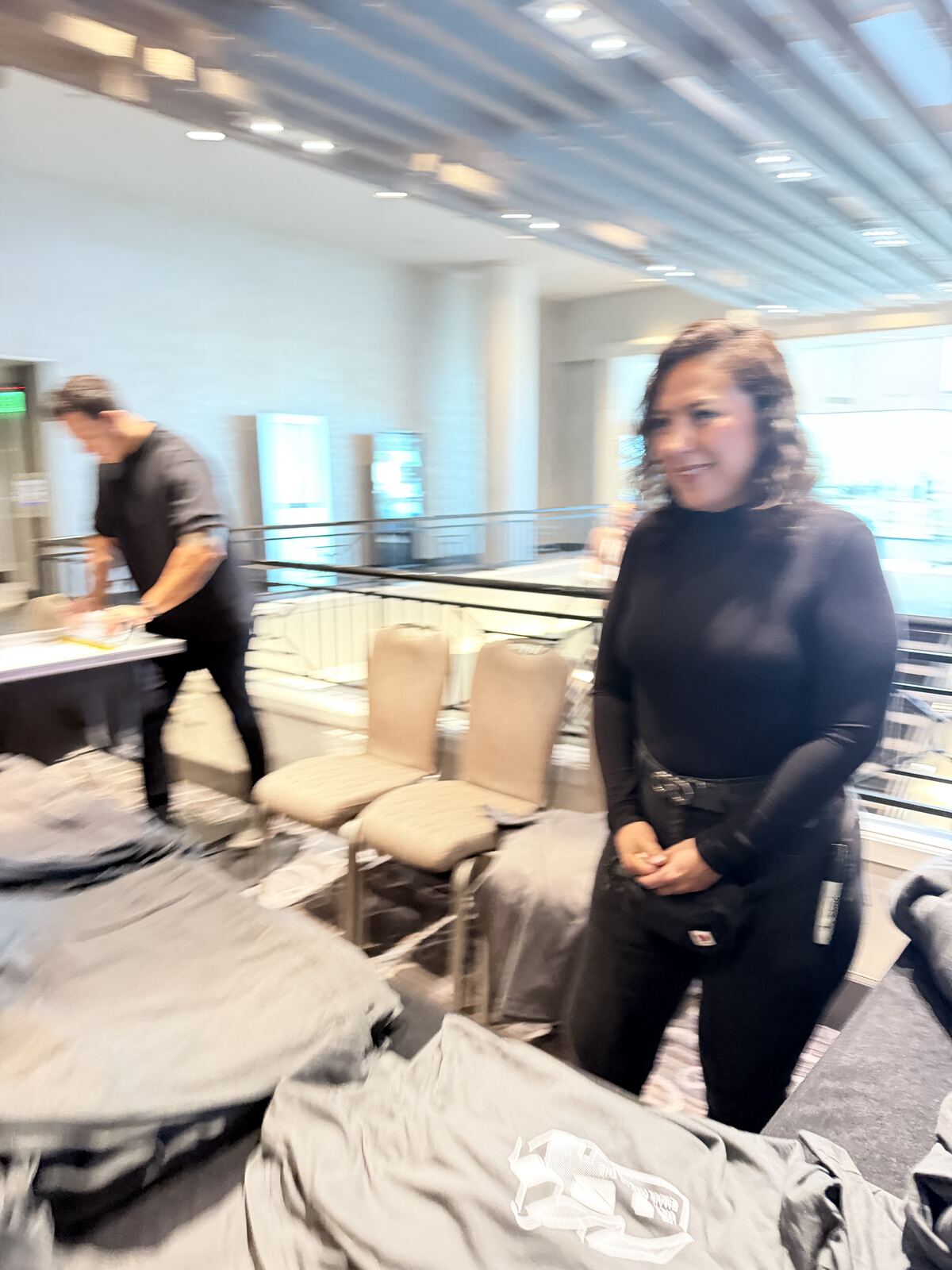 Person standing at an event booth