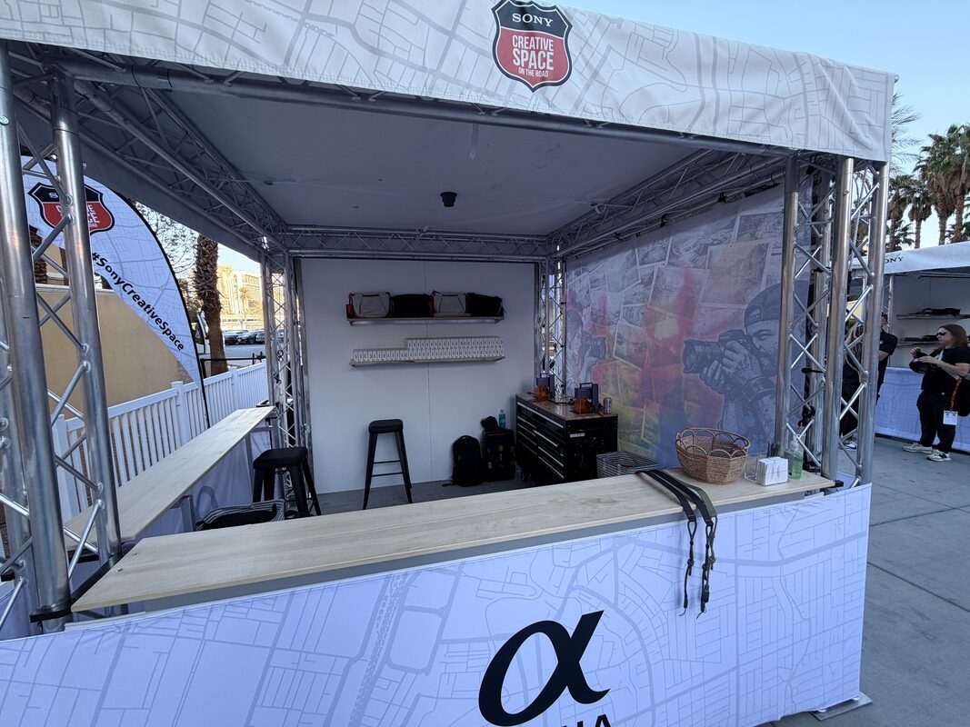 Energy on the show floor around a live concert merch activation